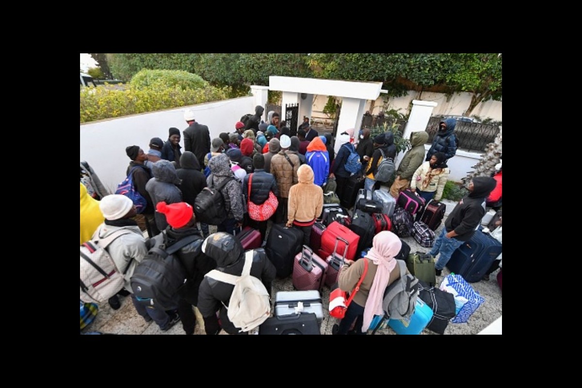 Group of migrants protest in Tunis in front of the IOM headquarters