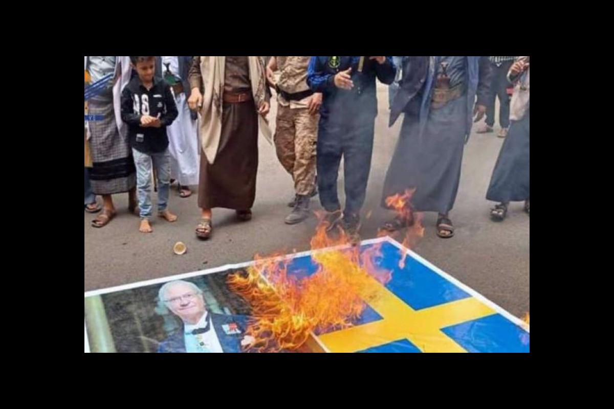Yemen, Swedish flag on fire after desecration of the Quran