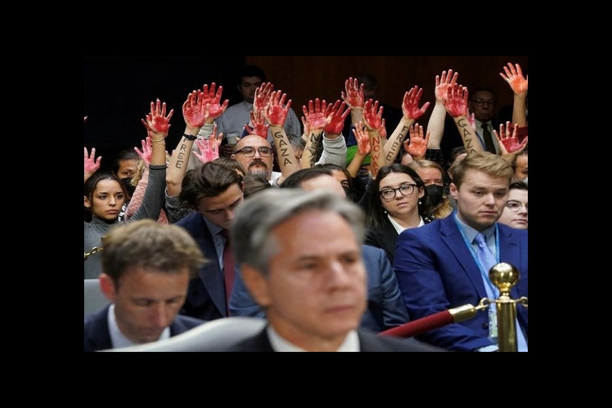 Repeatedly interrupting Blinken's speech to Congress with the raising of bloody hands!