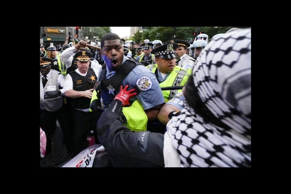 Pro-Palestinian protesters clash with police near Chicago’s Israeli consulate on second night of DNC