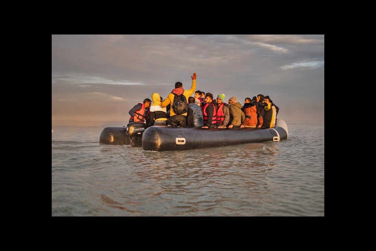 A boat with 50 migrants sinks in waters off northern France and some are in critical condition