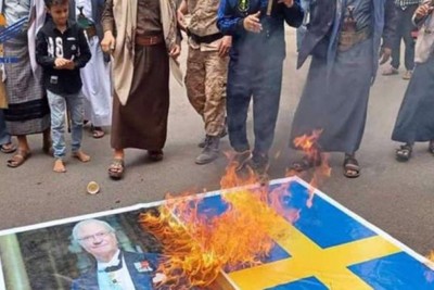 Yemen, Swedish flag on fire after desecration of the Quran