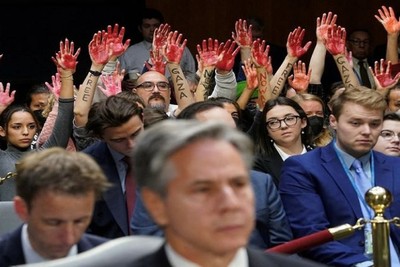 Repeatedly interrupting Blinken's speech to Congress with the raising of bloody hands!