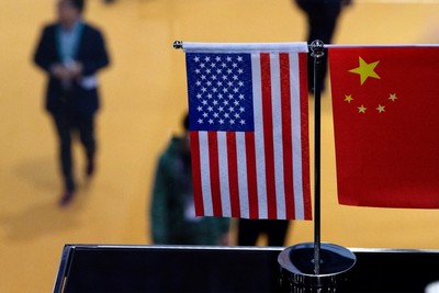 A top White House official says US and China are working to avoid conflict at talks in Beijing