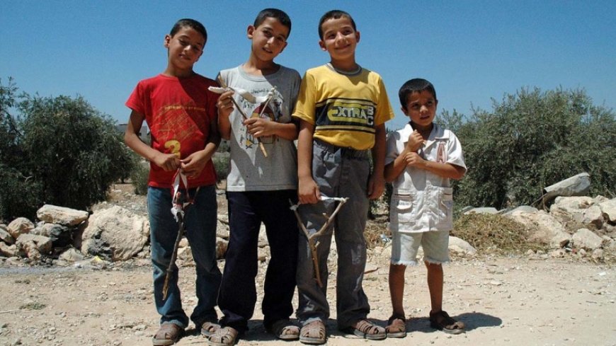 Palestinian children live in the rubble of Gaza