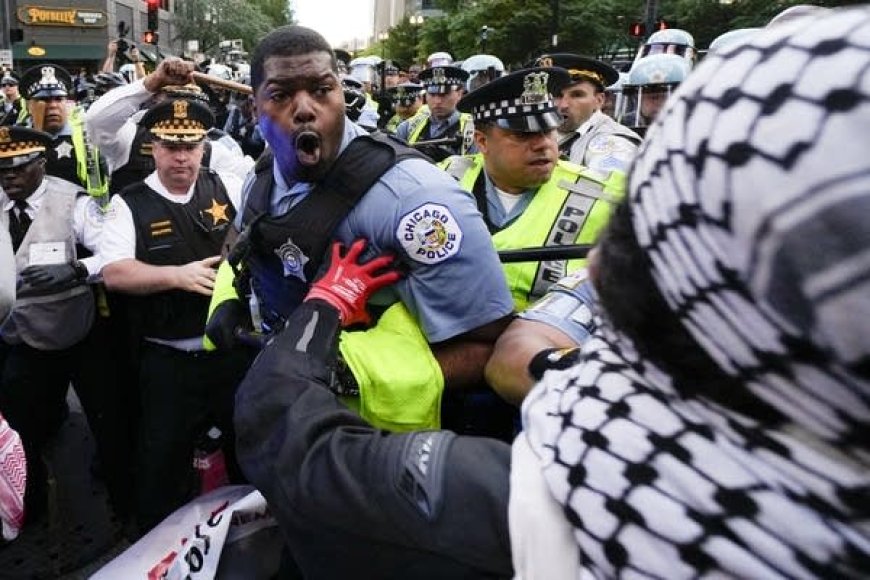 Pro-Palestinian protesters clash with police near Chicago’s Israeli consulate on second night of DNC