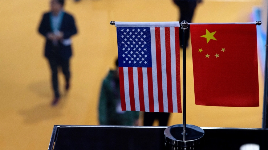 A top White House official says US and China are working to avoid conflict at talks in Beijing